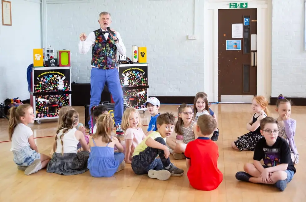 Close-up magic performance at a children's party