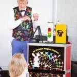 Kids' party entertainer with colourful magic props