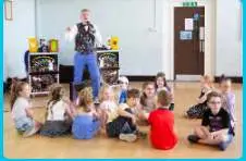 Kids' party entertainer with colourful stage props