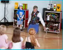 Children enjoying an interactive magic performance