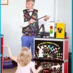 Children's entertainer performing magic for young children