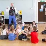 Close-up magic performance at a children's party