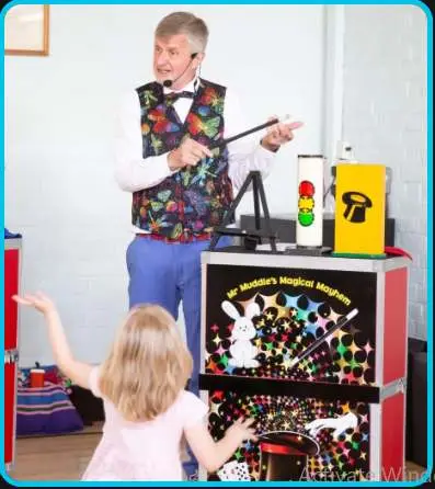 Children's entertainer performing magic for young children