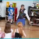 Children enjoying an interactive magic performance