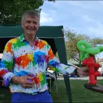 Children's entertainer performing a live stage magic trick